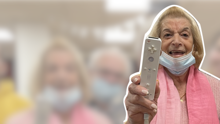 Grandmother plays videogames in nursing home